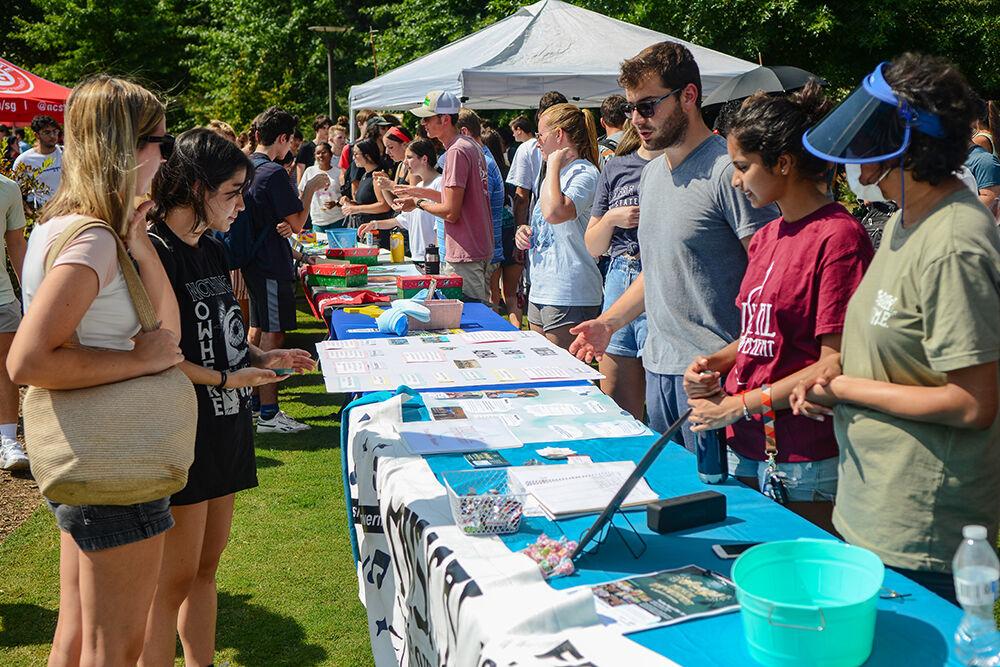 Members of the Musical Empowerment Club talk with interested students at the Student Involvement Fair at Stafford Commons on Friday, Aug. 26, 2022. The Musical Empowerment club gave music lessons which nurture meaningful relationships between collegiate mentors and children in under-served communities based on a shared love of music.