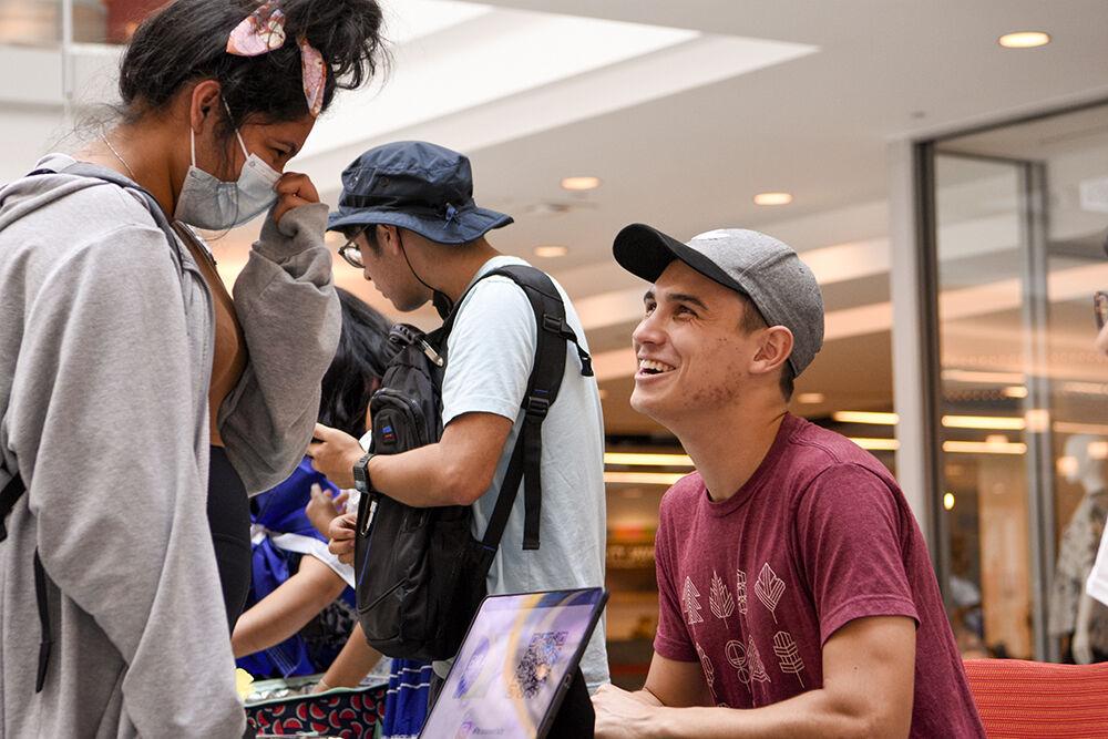 Kevin Manzanarez, a second-year studying agricultural education, talks with a student about Brazilian culture on Thursday, Sept. 15, 2022 at Talley Student Union. Latinx Heritage Month Kickoff was an event hosted by Latinx students to provide students with an opportunity learn about latinx cultures and conversate with their peers.