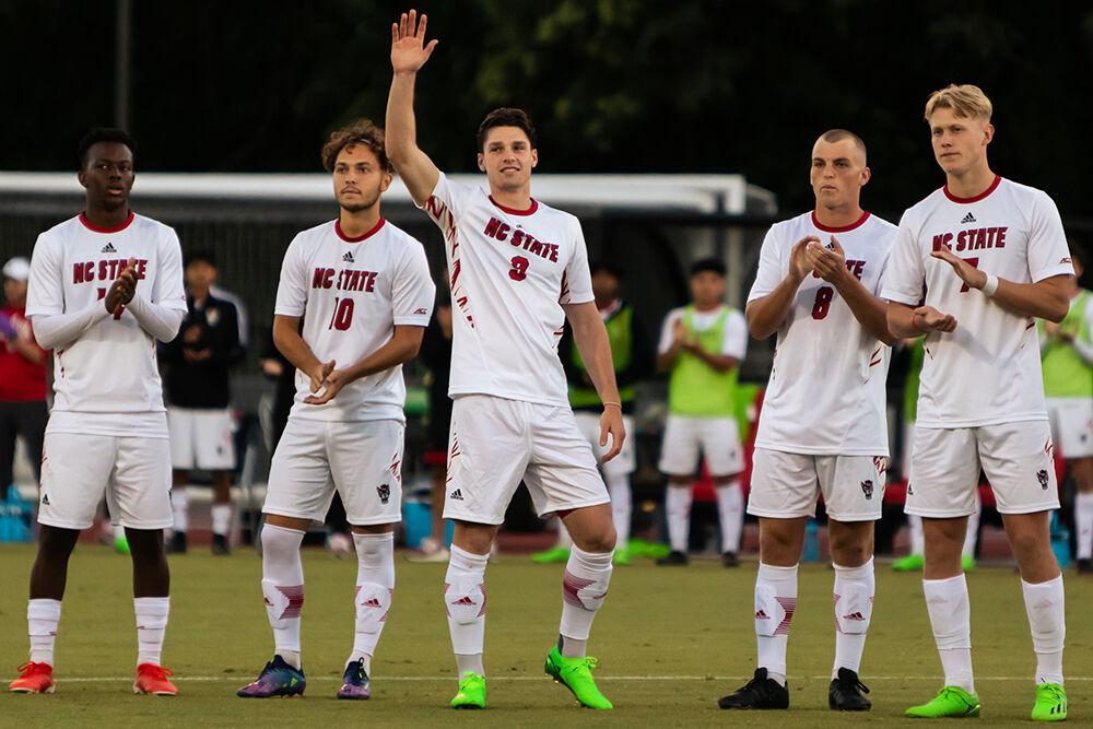 Sophomore forward Luke Hille waves at the crowd at the beginning of the match against Virginia Tech on Friday, Sept. 23, 2022 at Dail Soccer Field. Hille scored one goal for the Wolfpack. NC State beat Virginia Tech 1-0.