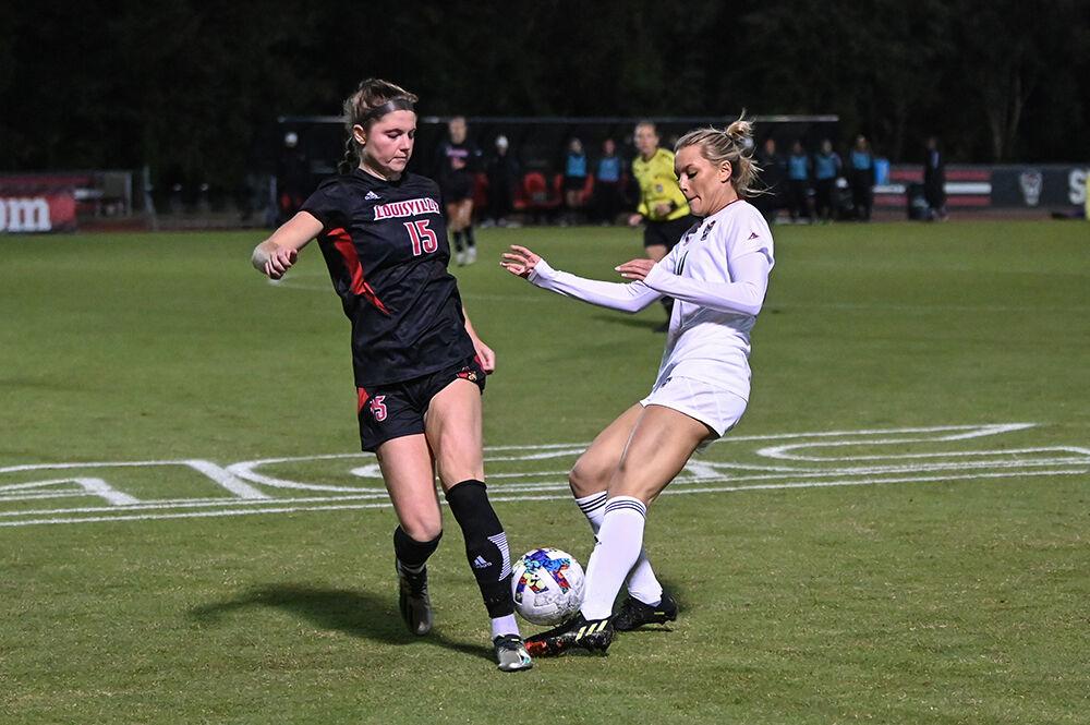 Junior forward Mia Vaughn attempts to gain possession of the ball during the match against Louisville on Thursday, Oct. 20, 2022 at Dail Soccer Field. Vaughn attempted one shot on the goal for the Wolfpack. NC State lost 1-0 to Louisville.