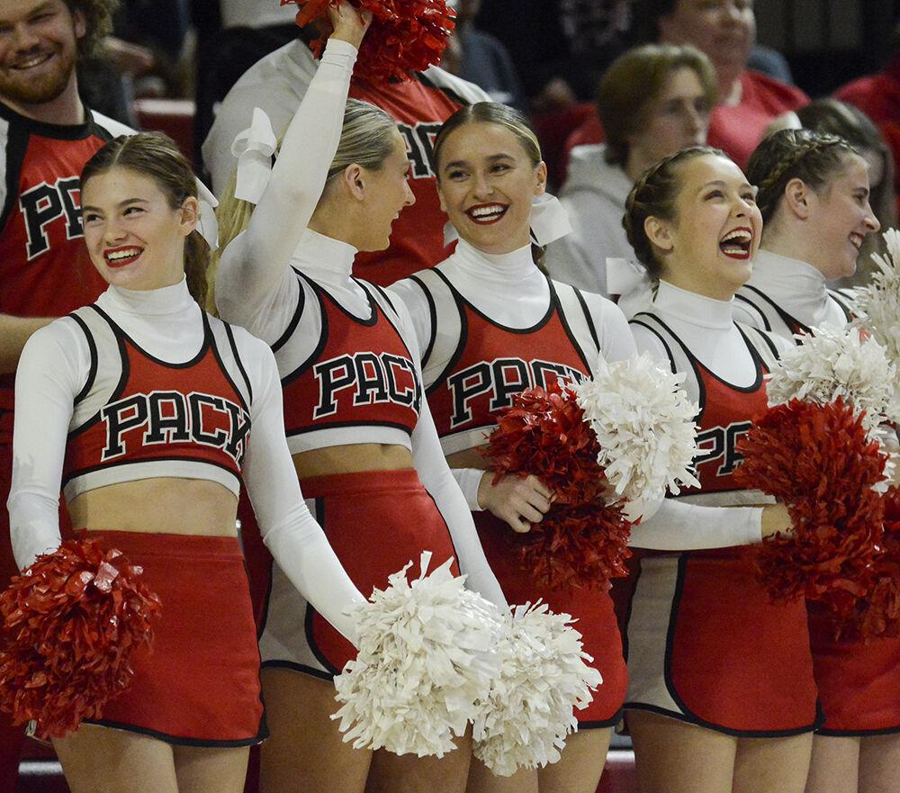Members of the NC State cheerleading team cheer during the game against UNC-Chapel Hill on Friday, Oct. 22, 2022 in Reynolds Coliseum. The Wolfpack lost 3-0.