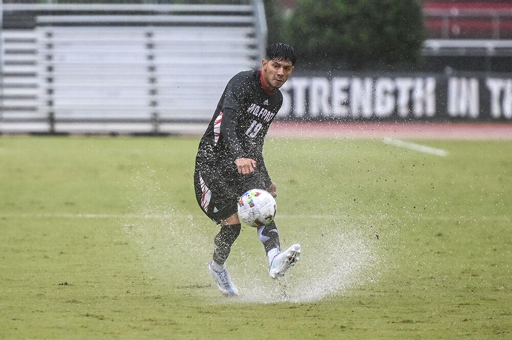 Graduate defender Alex Bautista kicks the ball during the match against Louisville on Friday, Sept. 30, 2022 at Dail Soccer Field. NC State lost 1-0 to Louisville.