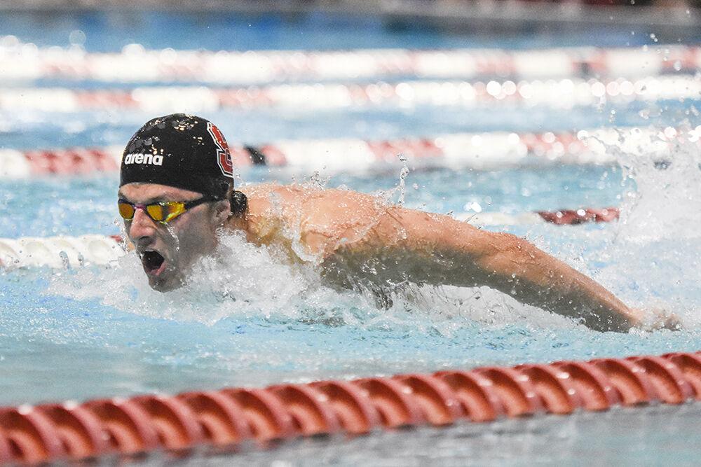 Freshman Drew Salls competes in the men's 100-yard butterfly during the NC State Wolfpack's swim and dive meet against the Kentucky Wildcats on Friday, Oct. 21, 2022 at the Willis R. Casey Aquatics Center. The Pack men beat the Wildcats 188-105.