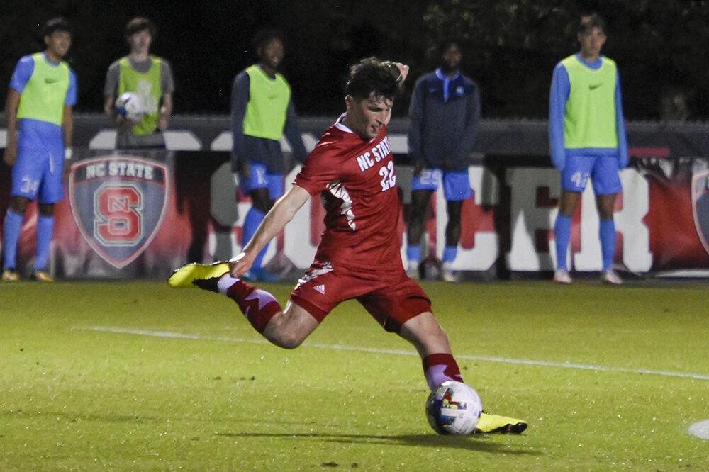 Graduate midfielder Conor Kelly kicks the ball during the match against UNC-Chapel Hill on Friday,&#160;Oct. 14, 2022 at Dail Soccer Field. Kelly scored one goal for the Wolfpack. NC State tied 2-2 with&#160;UNC-Chapel Hill.