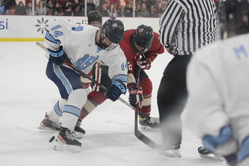 Senior forward Matt Miller battles a UNC-Chapel Hill player for the puck during the NC State versus UNC-Chapel Hill game at Wake Competition Center on Friday, Sept. 30, 2022. NC State lost 5-3.