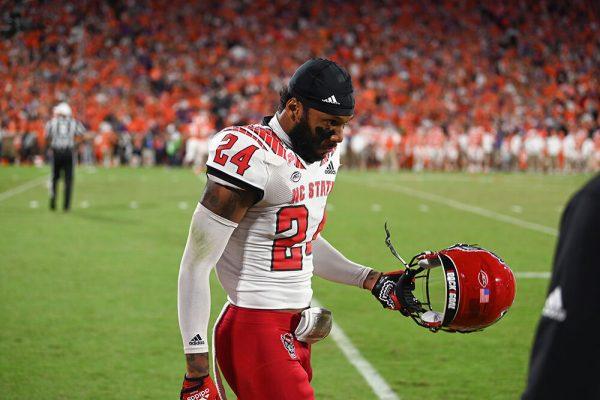 Graduate student cornerback Derrek Pitts Jr. removes his helmet during the game against Clemson on Saturday, Oct. 1, 2022 in Clemson Memorial Stadium. Pitts Jr. had six total tackles. The Wolfpack lost to the Tigers 30-20.