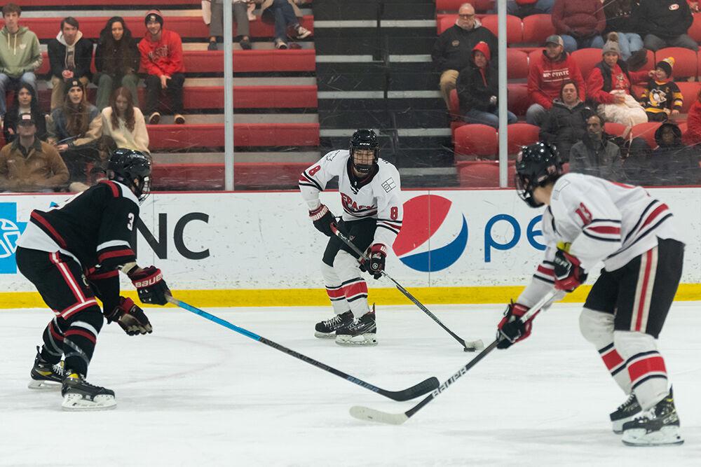 Freshman forward Zachary Herman prepares to pass the puck during the game versus Cincinnati on Friday Nov. 18, 2022 at Wake Competition Center. The Icepack lost to the Bearcats 6-3.