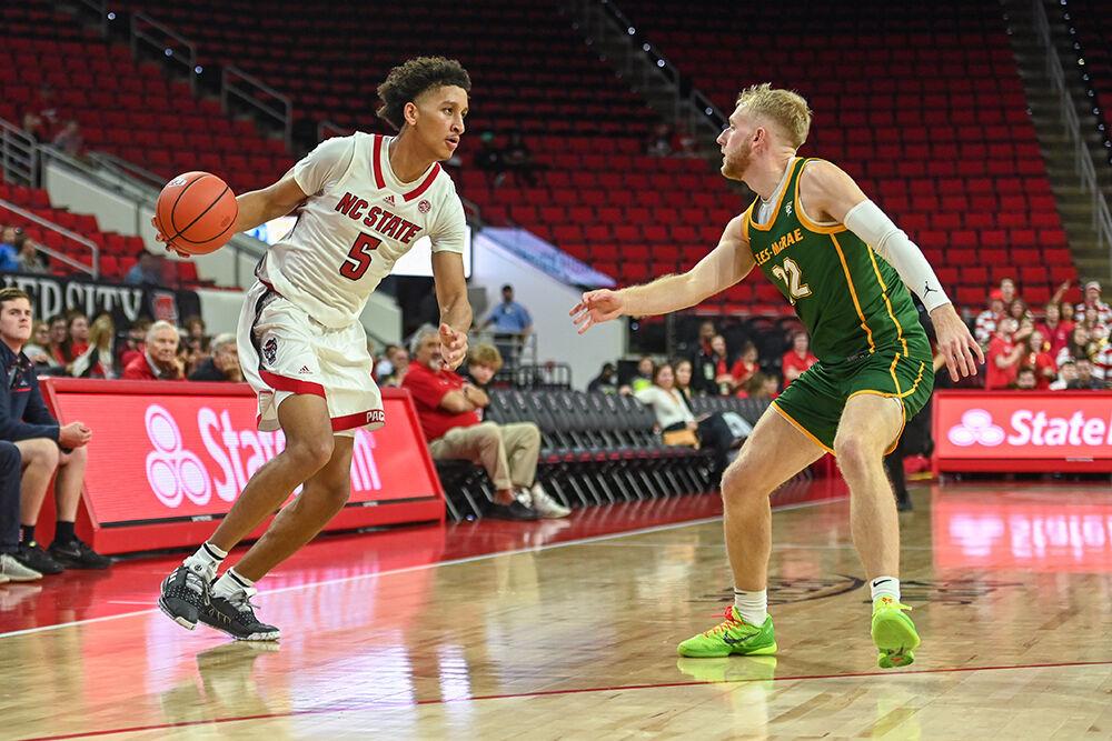 Graduate student guard Jack Clark attempts to get past an opponent during the game against Lees-McRae College in PNC Arena on Wednesday, Nov. 2, 2022. Clark scored 10 points. The Wolfpack beat the Bobcats 107-59.