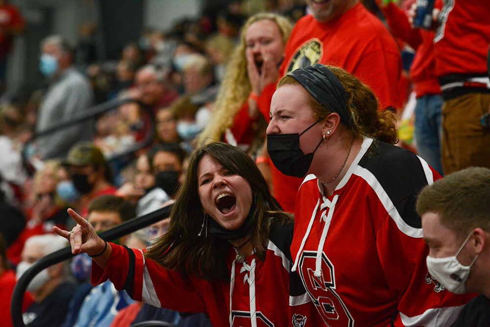 Sophomores Cam Rhinehardt and Ashley Martin celebrate one of the Wolfpack's goals. The&#160;Icepack defeated the UNC Tar Heels 10-3 in its first hockey match of the season at Wake Competition Center on Friday, Sept. 17, 2021.