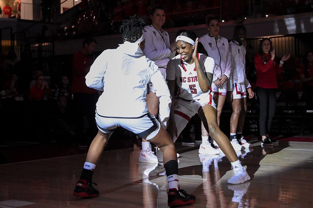 Senior forward Jada Boyd smiles during the announcing of the starting five players before the game against Quinnipiac on Monday, Nov. 7, 2022 in Reynolds Coliseum. Boyd led in scoring with 14 points and made five rebounds for the Wolfpack. NC State beat Quinnipiac 82-45.