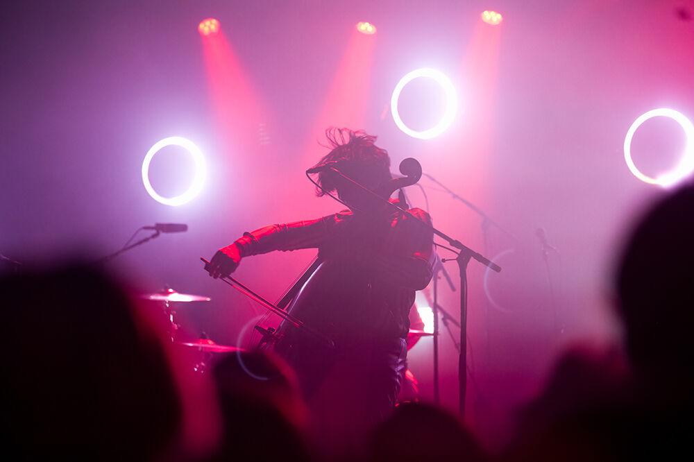 Calvin Langman of The Happy Fits sings and plays cello during their concert at Cats Cradle on Tuesday Dec. 13, 2022. The Happy Fits have released three albums since their inception in 2018.