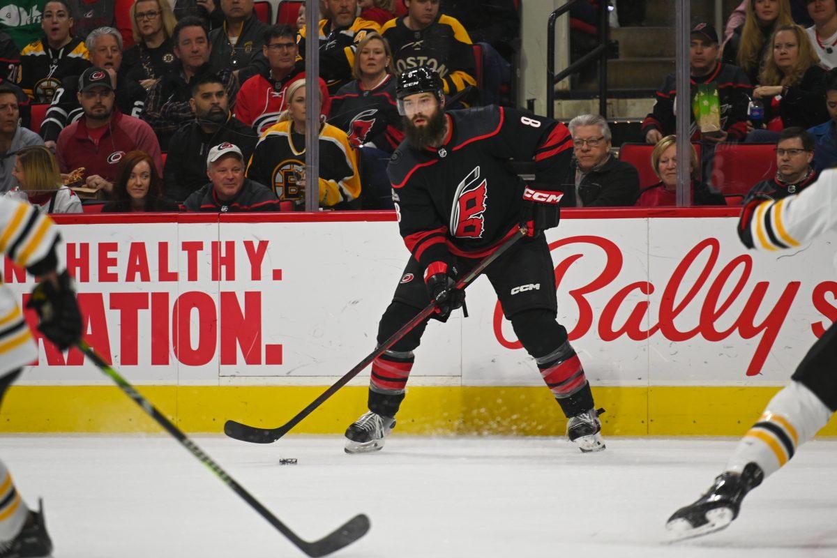 Carolina Hurricanes defenseman Brent Burns looks to pass the puck during the game against the Boston Bruins in PNC Arena on Sunday, Jan. 29, 2023. The game marked Burns' 1300th career game. The Hurricanes beat the Bruins 4-1.
