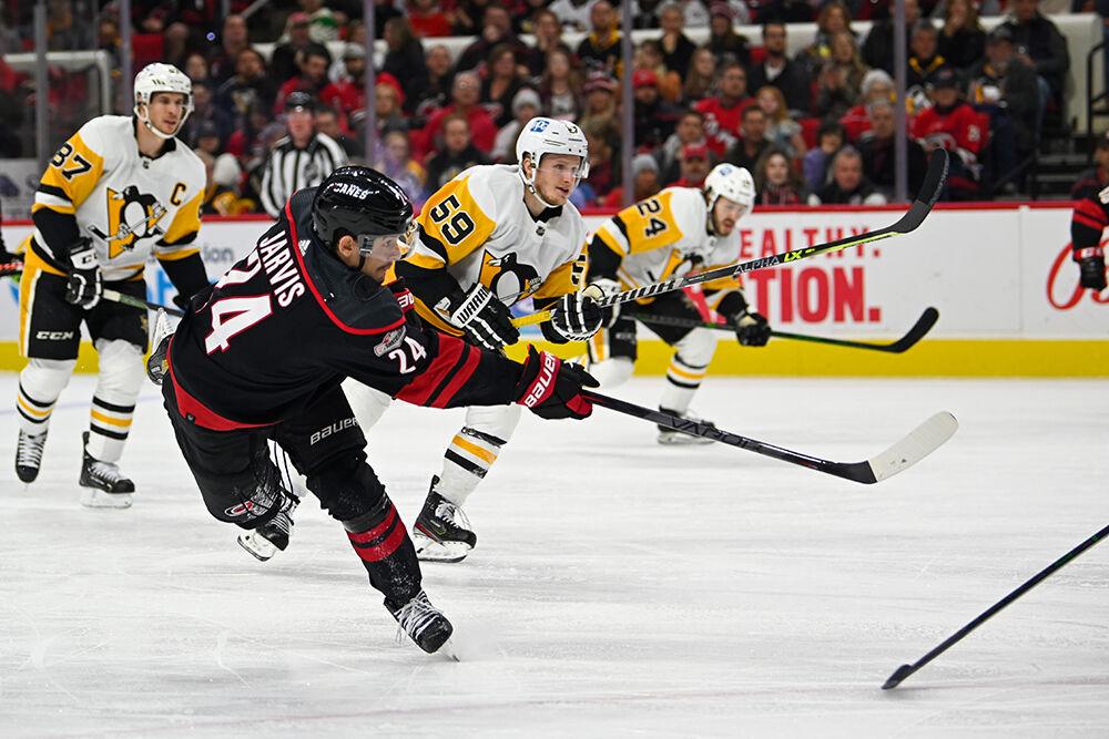 Carolina Hurricanes center Seth Jarvis shoots the puck during the game against the Pittsburgh Penguins in PNC Arena on Saturday, Jan. 14, 2023. The Hurricanes beat the Penguins 2-1.