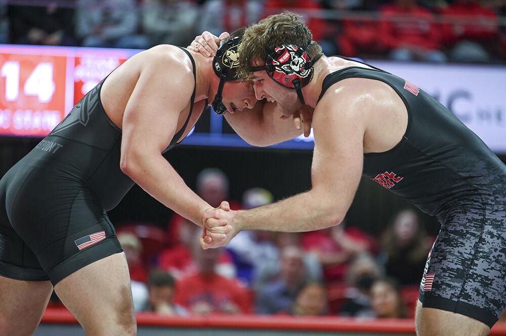 Redshirt sophomore Owen Trephan locks arms with his opponent during the 285 bout of the NC State duel against Army on Friday, Jan. 13, 2023 in Reynolds Coliseum. Trephan won his bout 22-7. NC State beat Army 30-6.