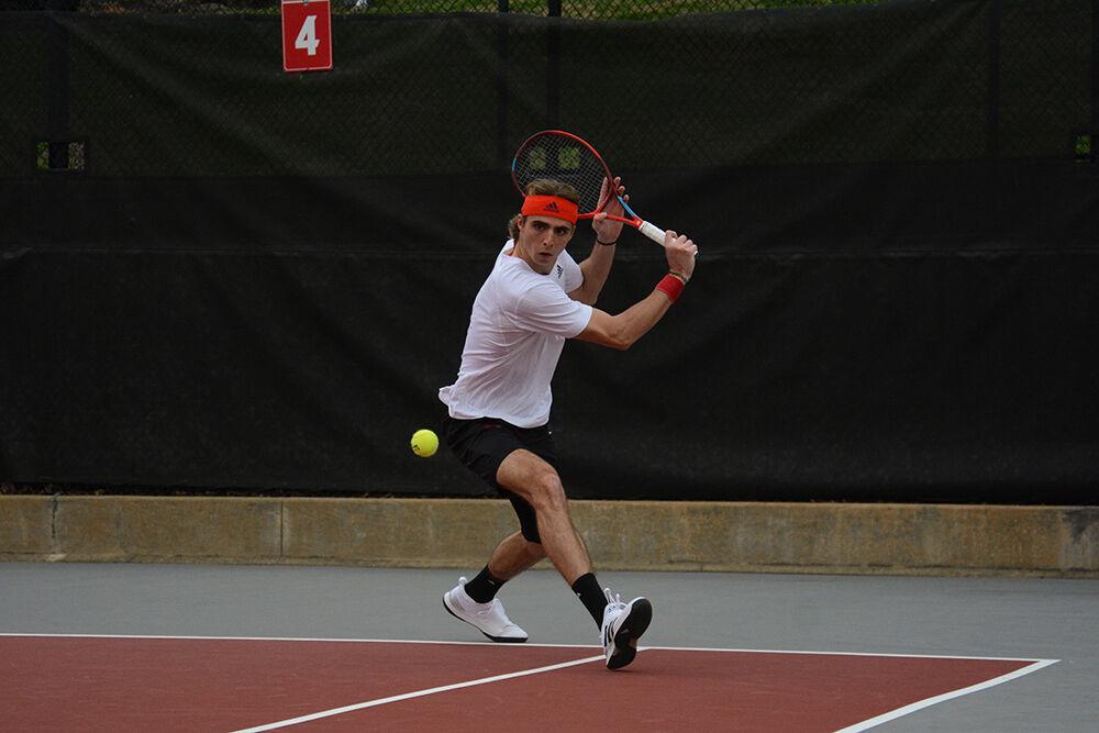 Senior Robin Catry prepares to backhand the ball during the match against Elon University at Dail Outdoor Tennis Stadium on Sunday, Feb. 26, 2023. Catry won his singles match 2-0 and the Wolfpack beat the Phoenix 5-2.