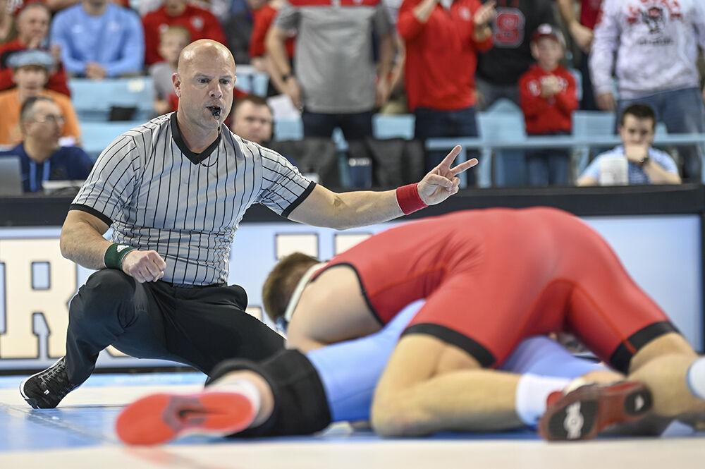 Redshirt junior Alex Faison takes down during the wrestling duel against UNC-Chapel Hill in Carmichael Arena on Friday, Feb. 17, 2023. Faison won the 174 bout 6-1. NC State beat UNC 28-6.