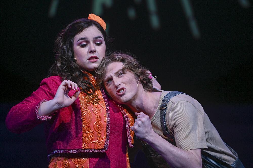 Jake Ensey, a third-year studying English and theatre, as Bobby Strong leans on Mary Elizabeth Furr, a fourth-year studying history and theatre, as Hope Cladwell as Ensey sings "Follow Your Heart" during the Urinetown musical in Stewart Theatre on Tuesday, Feb. 21, 2023. The musical was about citizens fighting against a company that regulated toilet usage during a 20-year drought.