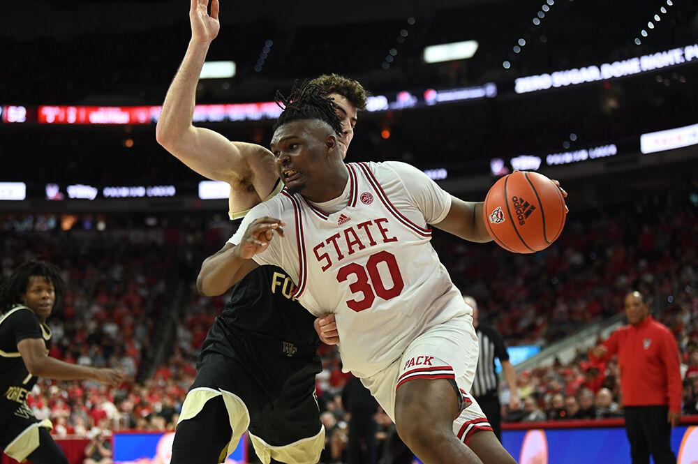 Graduate forward DJ Burns Jr. makes his way toward the basket during the Wolfpack's home game against the Demon Deacons in PNC Arena on Wednesday, Feb. 22, 2023. Burns scored 21 points as the Wolfpack beat the Demon Deacons 90-74.