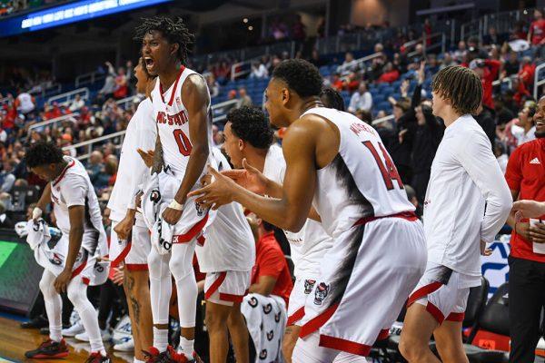 Sophomore guard Terquavion Smith (left) celebrates during the second round of the ACC Tournament game against Virginia Tech in Greensboro Coliseum on Wednesday, March 8, 2023. Smith scored 30 points and made eight rebounds during the game. NC State beat Virginia Tech 97-77.