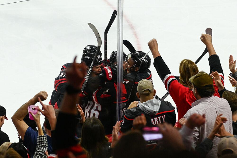 The Carolina Hurricanes celebrate in front of the fans after scoring during the Hurricanes' home game against the Tampa Bay Lightning in PNC Arena on Sunday, March 5, 2023. The Canes beat the Lightning 6-0.