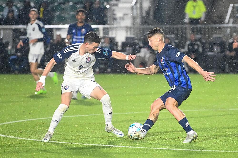 NCFC forward Rafa Mentzingen manuevers the ball away from his opponent in the game against the South Georgia Tormenta FC at WakeMed Soccer Park on Friday, March 17, 2023. Mentzingen made 39 passes and won five duels. NCFC lost the game to the South Georgia Tormenta FC 1-0.