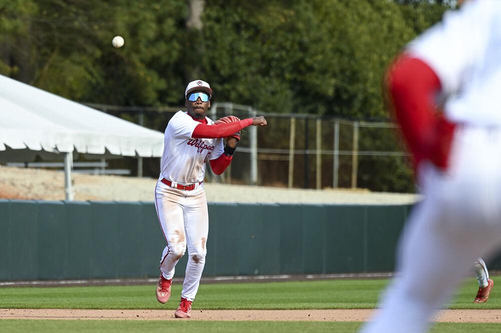 Junior infielder LuJames Groover III throws the ball to first base during the game against Elon at Doak Field at Dail Park on Tuesday, March 14, 2023. NC State lost to Elon 14-6.