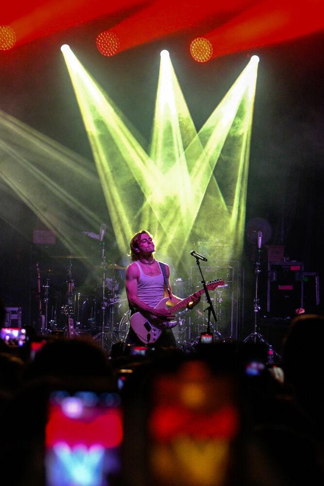 Ross Lynch from the Driver Era plays the guitar during Wolfstock at Stafford Commons on Saturday, April 22, 2023. Ross Lynch performed alongside his brother Rocky Lynch at Wolfstock.