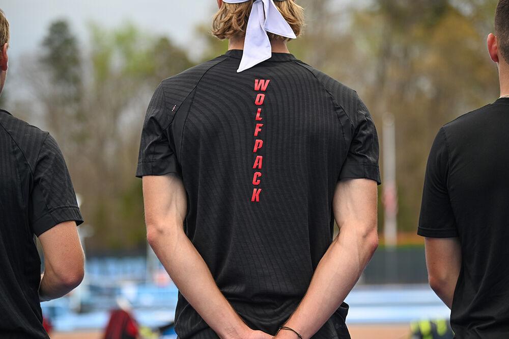 Senior Robin Catry stands for the national anthem during the away tennis match against UNC-Chapel Hill at the Cone-Kenfield Tennis Center on Friday, March 31, 2023. NC State beat UNC 4-1.