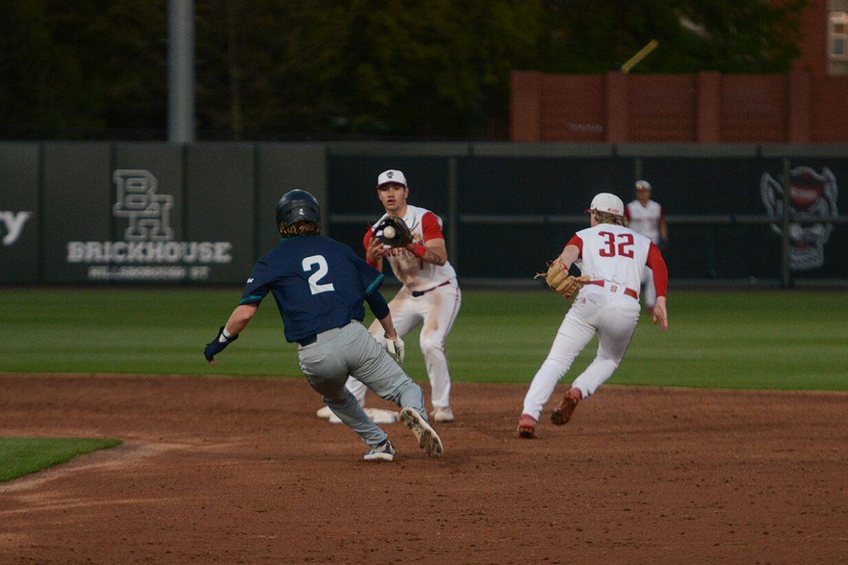 Junior infielder Kalae Harrison tags the Seahawk runner out at the home game against the UNC-Wilmington Seahawks at Doak Field at Dail Park on Tuesday April 11, 2023. Harrison had two hits and two RBI's during the game. The Wolfpack defeated the Seahawks 12-3.
