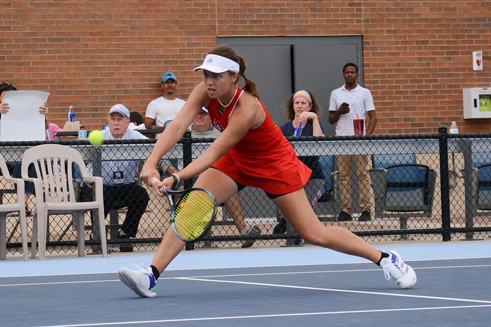 Freshman Anna Zyryanova backhands a close ball during the match against UNC-Chapel Hill at the Cone-Kenfield Tennis Center on Thursday, April 6, 2023. The Wolfpack lost to the Tar Heels 7-0.