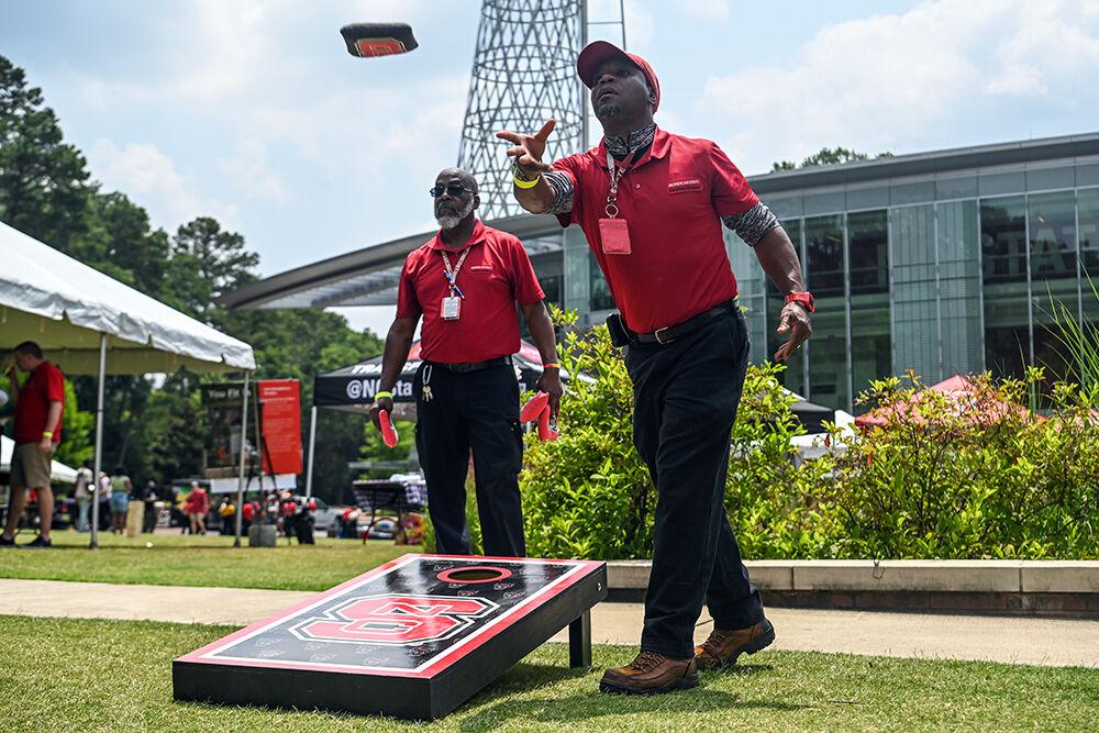 Vincent Carpenter and Ricky Rogers, housekeepers at NC State, play cornhole during the Juneteenth Celebrations at Stafford Commons on Monday, June 19, 2023. Juneteenth is a holiday that celebrates the emancipation of enslaved African Americans in the United States annually on June 19. The event had free food, games, speakers and live music.