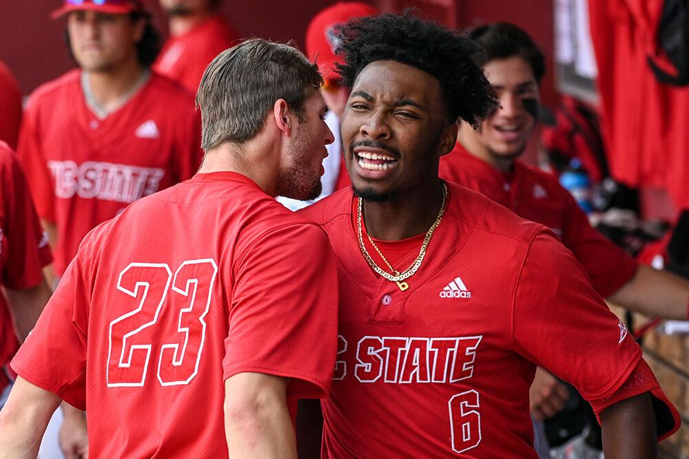 Junior infielder LuJames Groover celebrates hitting a home run with junior pitcher Matt Willadsen during the NCAA Tournament game against Campbell at Founders Park in Columbia, South Carolina on Friday, June 2, 2023. Groover hit two home runs and had two RBIs. NC State beat Campbell 5-1.