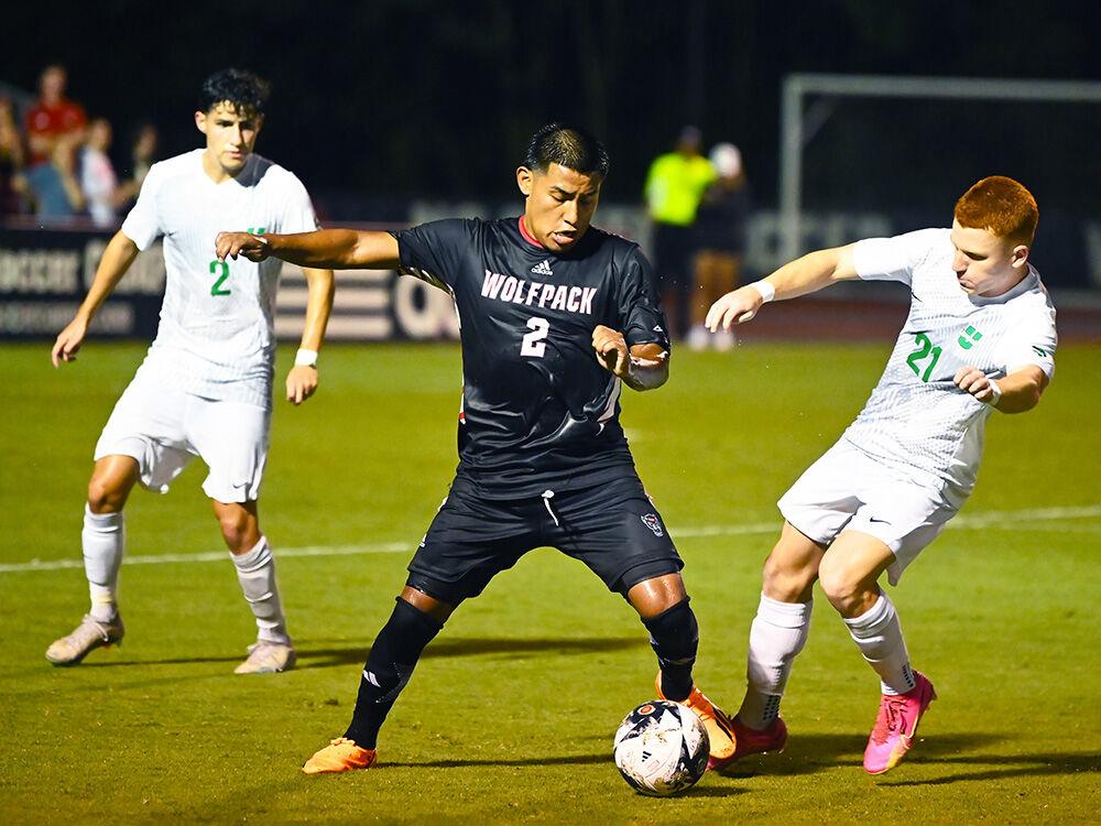Freshman forward Ervin Cruz fights an opponent for the ball during the match versus USC Upstate at Dail Soccer Field on Monday, Aug. 28, 2023. Cruz scored one goal and made one assist for NC State. NC State beat USC Upstate 3-0.