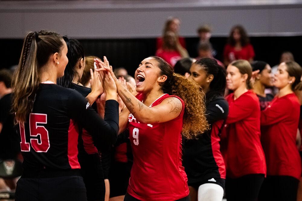Senior libero Skye Stokes (right) celebrates with sophomore middle blocker Lily Cropper after their match in Reynolds Coliseum on Saturday, Sept. 2, 2023. Stokes had three spikes during the match. NC State beat Winthrop 3-0.