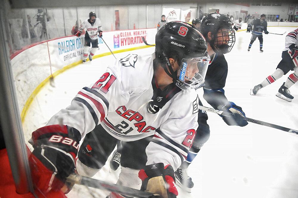 Junior forward Joey Gouveia crashes into the wall during the game versus University of Kentucky at Invisalign Arena on Friday, Sept. 22, 2023. NC State lost 5-2 to University of Kentucky.