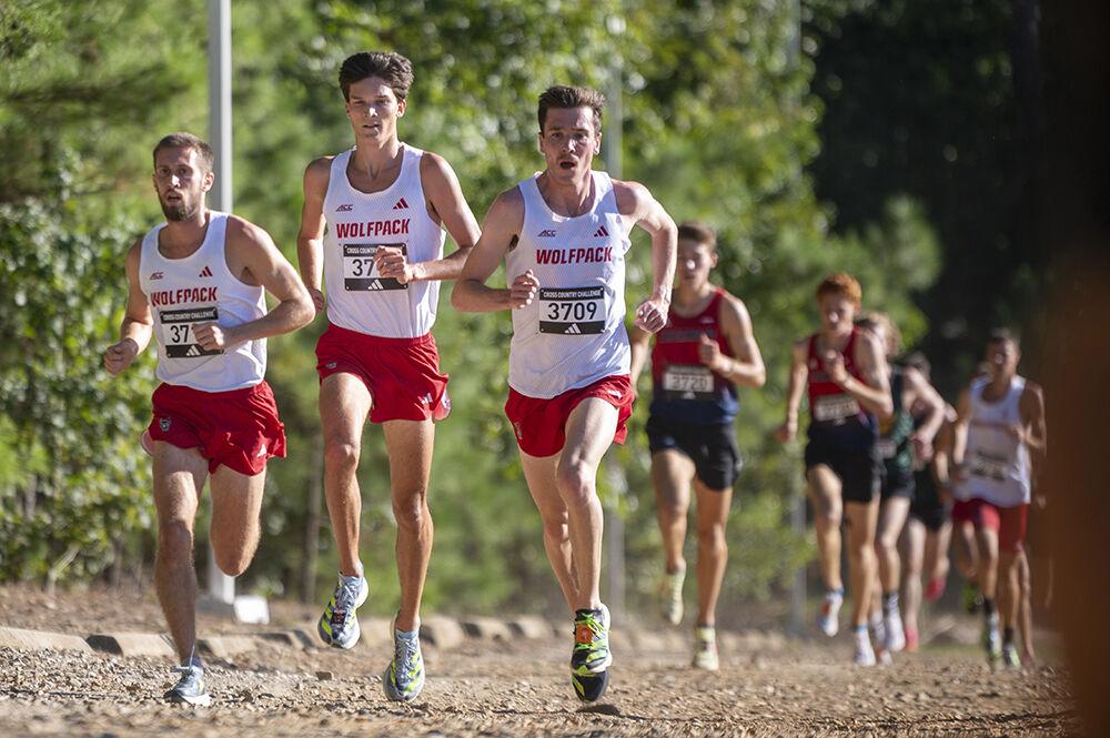 Senior runners Ian Harrison, JJ Malach, and graduate runner Toby Gualter leads the pack during the XC Adidas Challenge at WakeMed Soccer Park on Friday, Sept. 15, 2023 The men's cross country team won first place overall with Malach finishing first place with a time of 17:50.9.