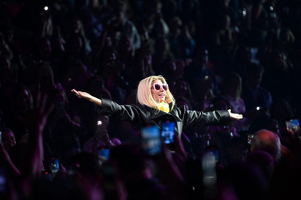 Shania Twain rises out of a box in the crowd to open her Queen of Me concert at PNC Arena on Wednesday, Oct. 18, 2023. Twain performed a fan inclusive concert that included bringing multiple fans on stage throughout the show.