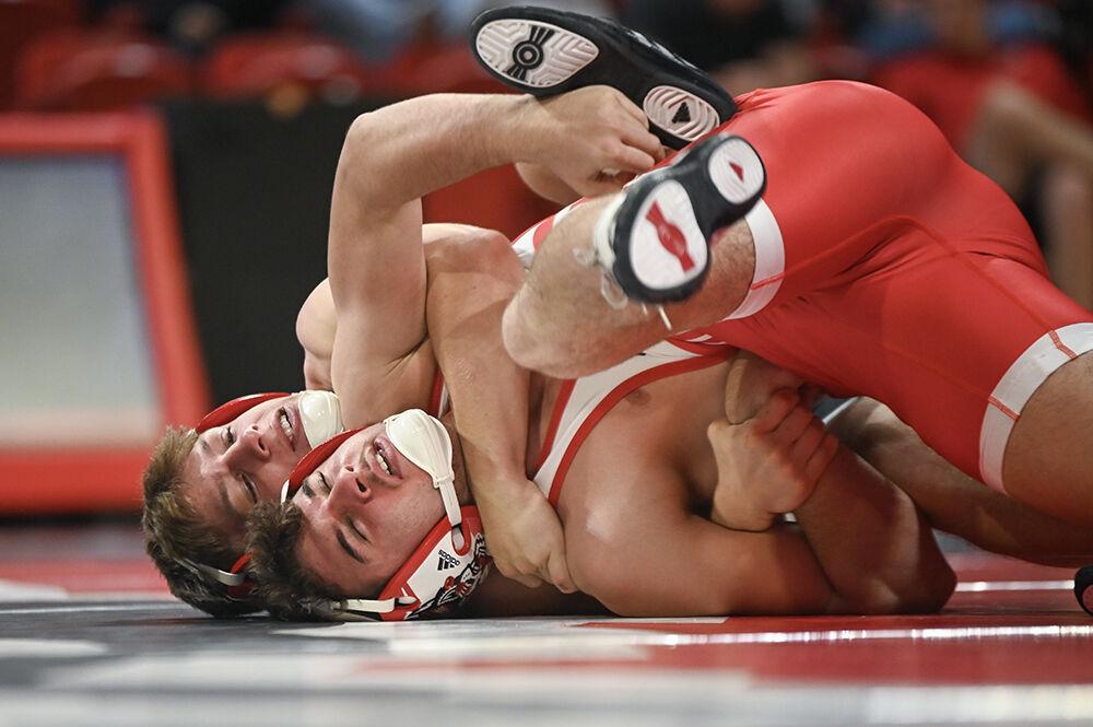 Freshman Koy Buesgens holds freshman Trevor Kantor to the ground during the NC State Wrestle-Offs in Reynolds Coliseum on Friday, Oct. 27, 2023. Buesgens beat Kantor in the 141 bout 15-1.