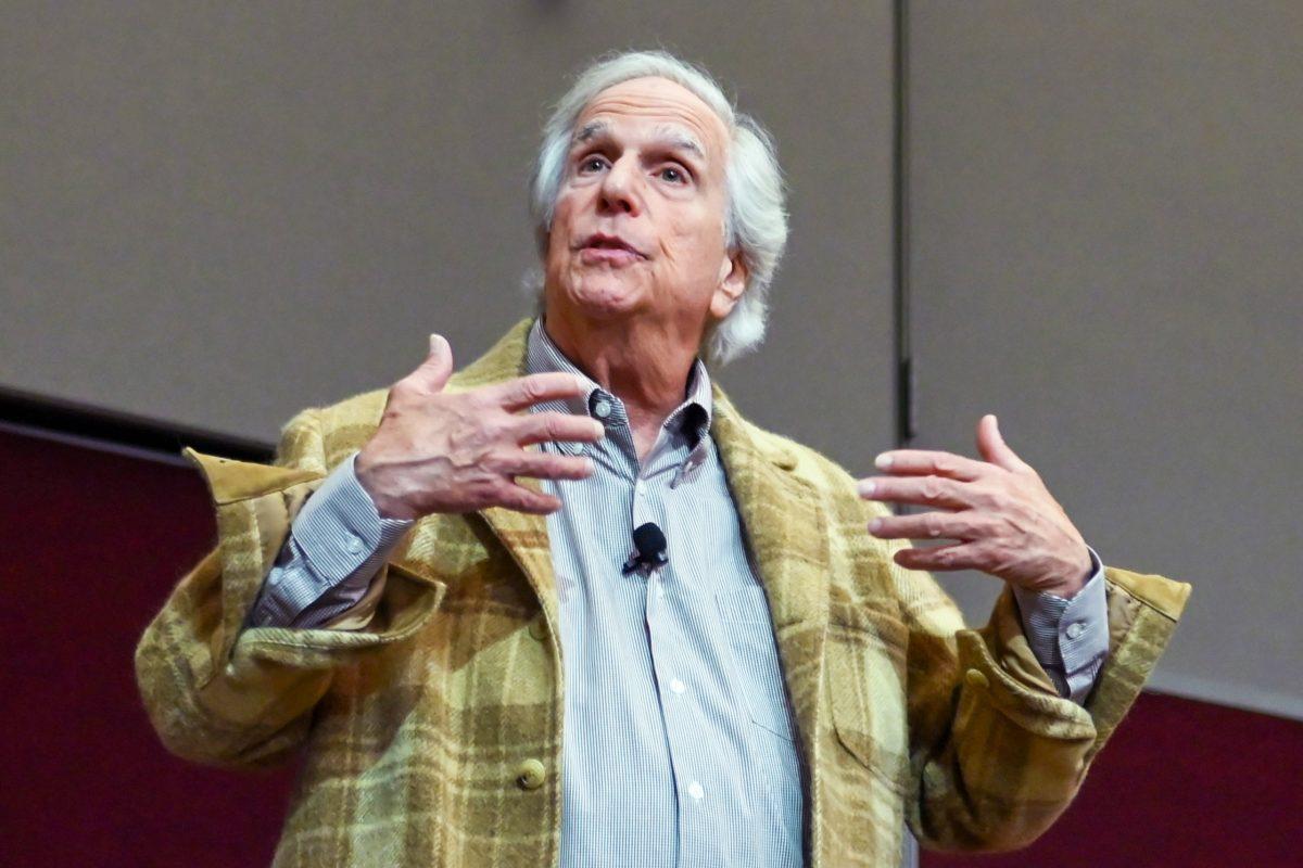 Actor Henry Winkler talks to the audience during the Author Event with Actor Henry Winkler at the McKimmon Center on Thursday, Nov. 16, 2023. The event focused on a conversation about Winkler's life, work, and his new memoir, "Being Henry: The Fonz...and Beyond". Henry Winkler is an actor best known for his role as "The Fonz" on the sitcom "Happy Days". He is also the author of numerous children's books, some of which are based on his own childhood experiences of using humor to cope with dyslexia and a difficult home life.