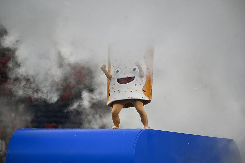 The Poptart Bowl mascot, Strawberry, acends out of a giant toaster before the Poptart Bowl between the NC State Wolfpack and the Kansas State Wildcats played in Camping World Stadium in Orlando, Florida on Thursday, Dec. 28, 2023. The Wildcats beat the Wolfpack 28-19.