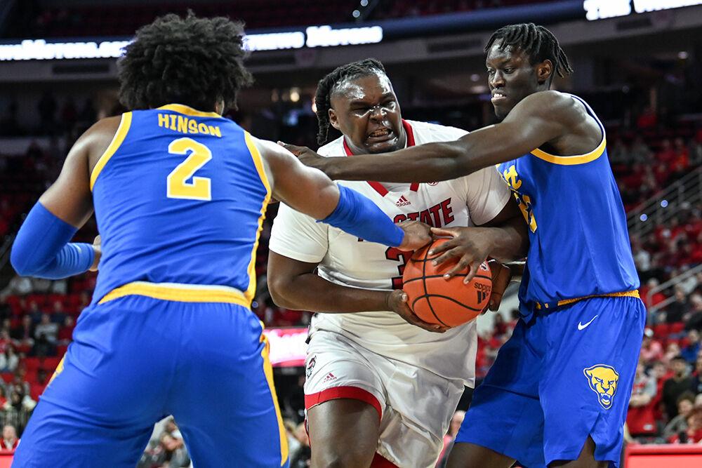 Graduate forward DJ Burns drives the ball through the defense to the basket during the game against Pittsburgh in PNC Arena on Wednesday, Feb. 7, 2024. Burns scored 19 points and made five rebounds. NC State lost to Pitt 67-64.