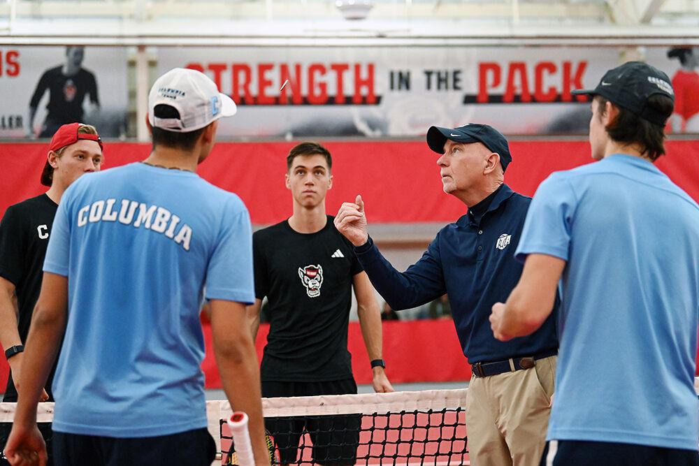 Junior Braden Shick watches as the referee flips a coin for first serve during the match against Columbia at J.W. Isenhour Tennis Center on Sunday, Feb. 4, 2024. Shick won both his doubles and singles matches. NC State lost to Columbia 4-3.