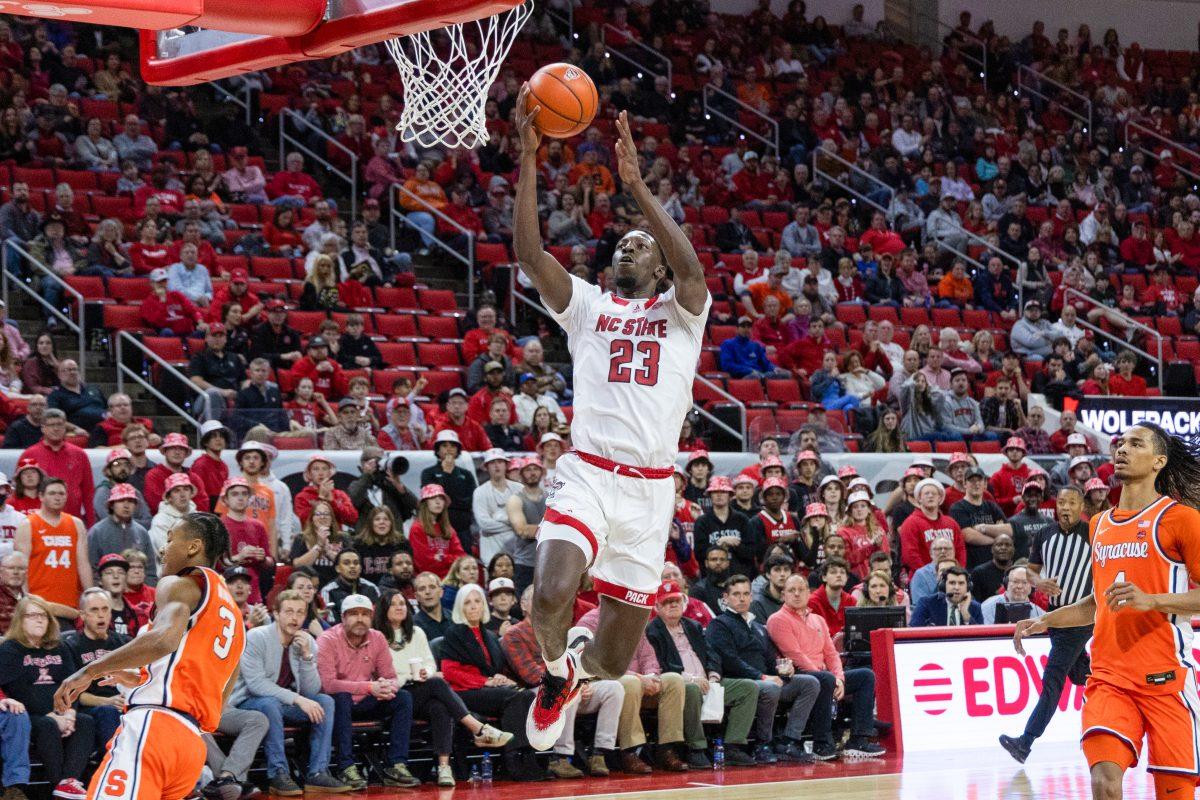 Junior Forward Mohamed Diarra leaps toward the basket during the game against Syracuse in PNC Arena on Tuesday, Feb 20, 2024. Diarra scored 7 points during the game. NC State lost to Syracuse 83-87.