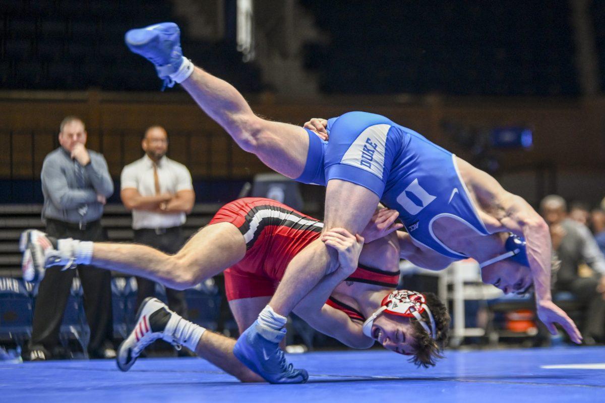 Redshirt freshman Troy Hohman brings his opponent to the ground during the wrestling match at Cameron Indoor Stadium on Sunday, Feb. 18, 2024. Hohman won the 125 bout after securing a 15-0 technical fall in the first period. NC State beat Duke 36-9.