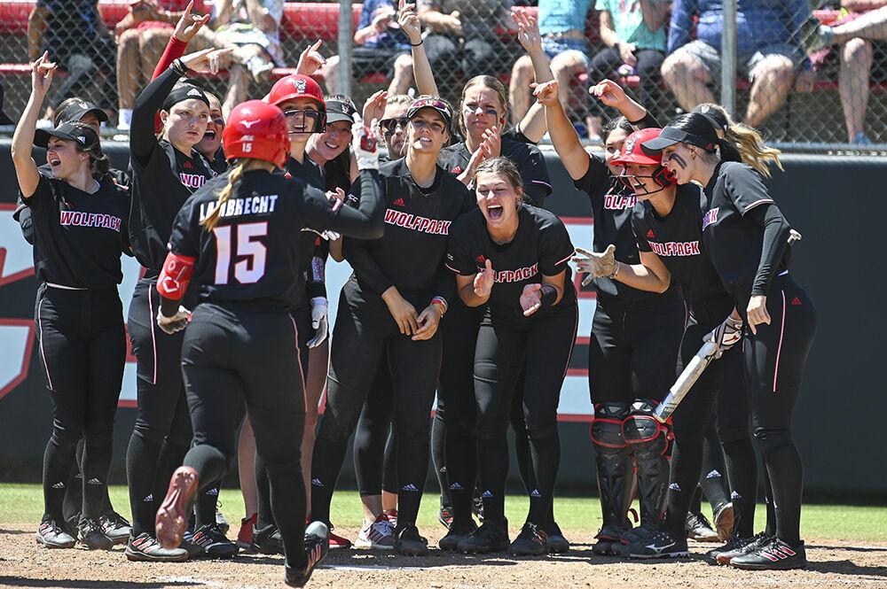 The NC State softball team celebrates a home run hit by junior infielder Kaylee Lambrecht during the game against UNC-Chapel Hill at Dail Softball Stadium on Saturday, April 23, 2023. NC State lost to Chapel Hill 4-2.