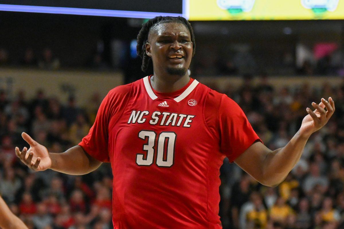 Graduate forward DJ Burns questions a call made during the game against Wake Forest at Lawrence Joel Veterans Memorial Coliseum on Saturday, Feb. 10, 2024. Burns scored 14 points and made four rebounds. NC State lost the game 83-79.