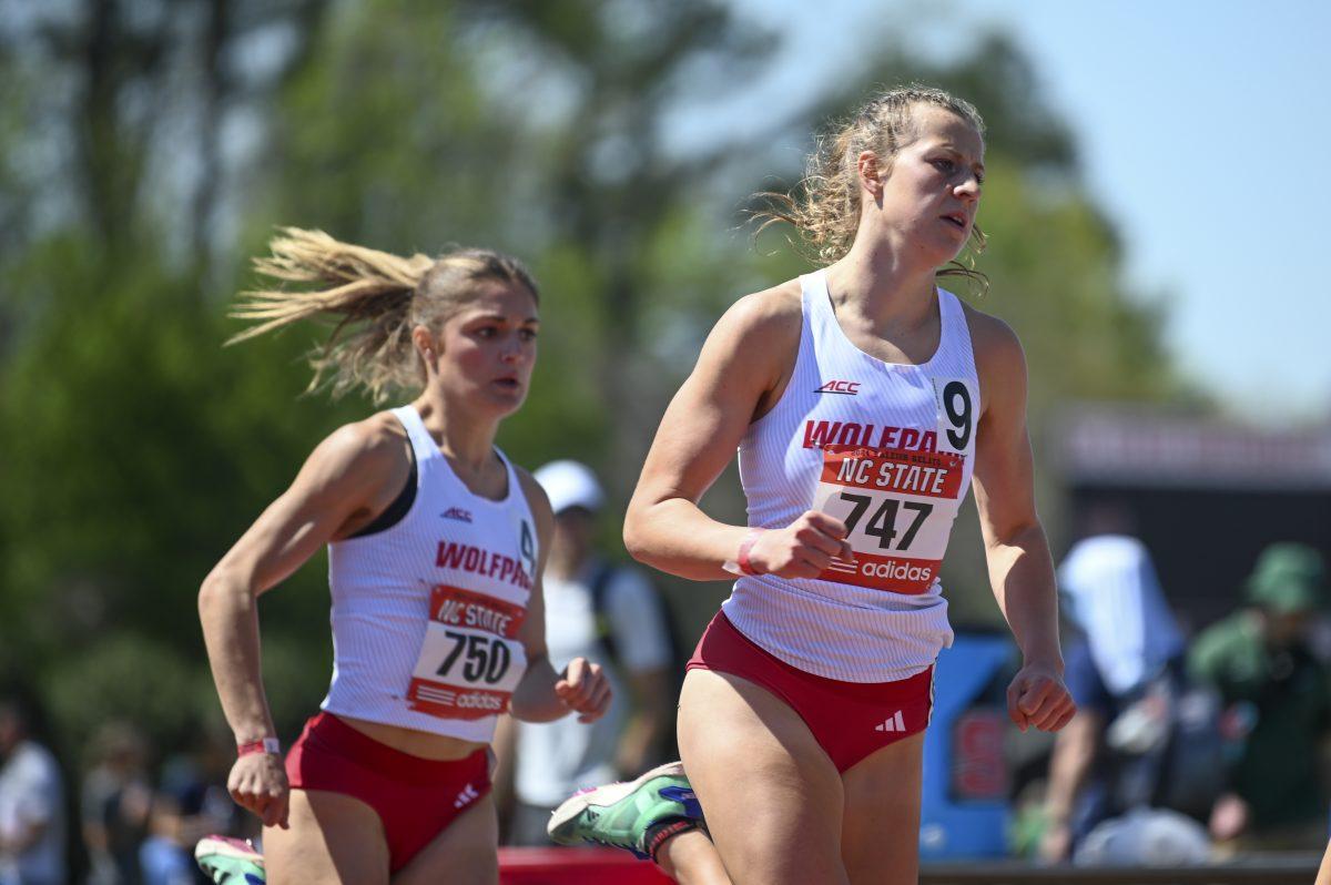 Freshman distance runners Angelina Napoleon and Kate Putman come off the final bend during the Raleigh Relays track meet at the Derr Track and Field Facility on Saturday, March 30, 2024. Napoleon finished the 800m dash with a time of 2:07.55 and Putman finished at 2:11.88.
