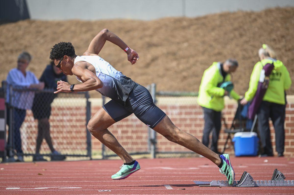 Freshman sprinter Quentin Clarke explodes out of the starting blocks during the Raleigh Relays track meet at the Derr Track and Field Facility on Friday, March 29, 2024. Clarke finished fifth overall and second in his heat for the men's 400m dash with a time of 47.64