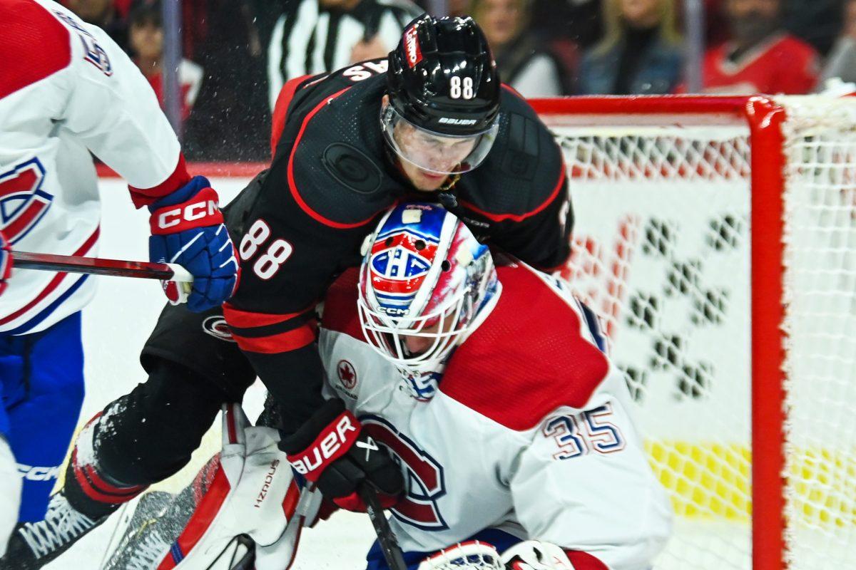 Right wing Martin Necas collides with the opposing goalie during the Carolina Hurricanes game versus the Montreal Canadiens on Thursday, March 7, 2024. The Hurricanes beat the Canadiens 4-1.
