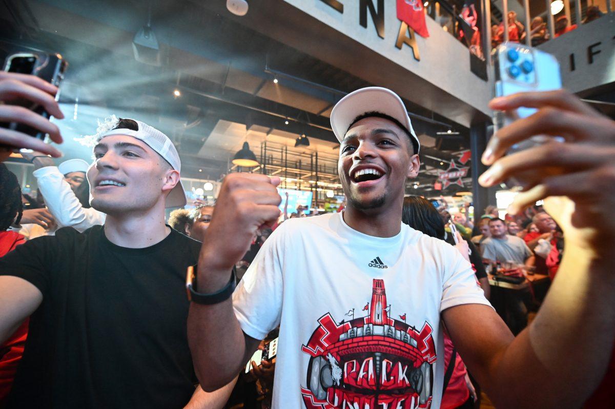 Graduate guards Michael O'Connell and Casey Morsell celebrate after it was announced that NC State would be playing the first round of the NCAA Tournament against Texas Tech at the Selection Sunday watch party in Sports &amp; Social on Sunday, March 17, 2024. NC State punched their ticket to the NCAA Tournament the night before by winning the ACC Tournament championship game.